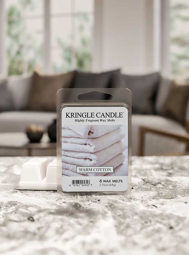 Kringle Candle wax melt package on a marble surface with a blurred living room background