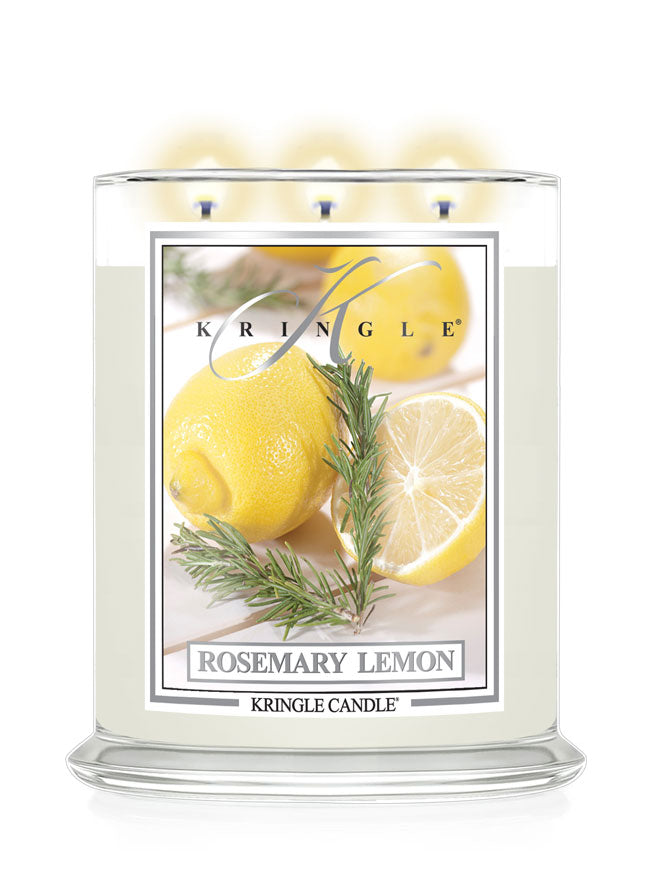 A Kringle Candle in a clear glass jar with three wicks, featuring a front label that reads 'Rosemary Lemon' and shows lemons, rosemary sprigs, and a candle flame graphic. The candle is shown on a clean white background.