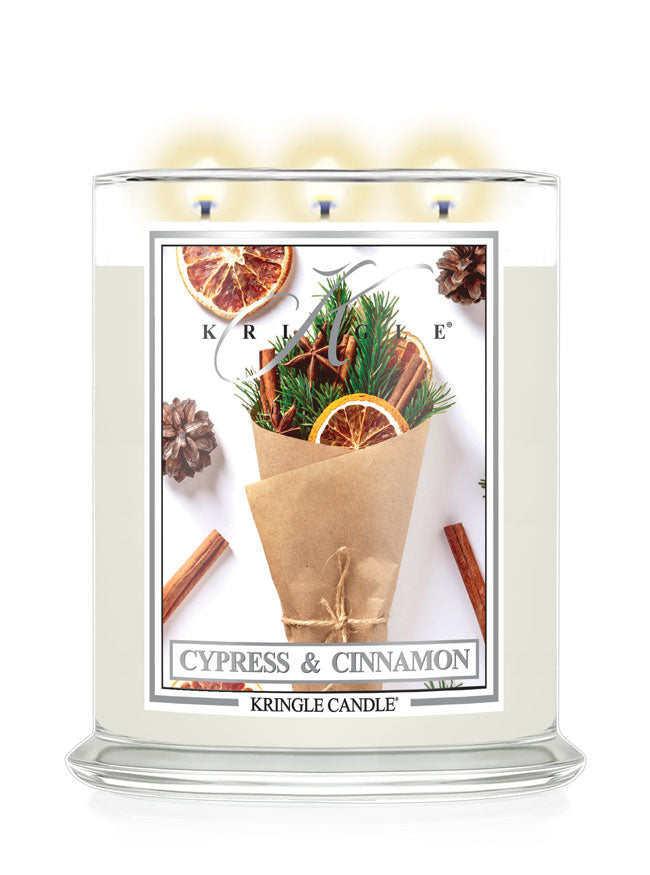 Kringle Candle Cypress & Cinnamon candle with decorative label on a white background